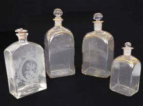 Three late 18th / early 19th century graduated gilt decorated spirit decanters - rectangular form