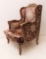 A French 18th century style stripped beech wood bergère armchair: second half 20th century; the