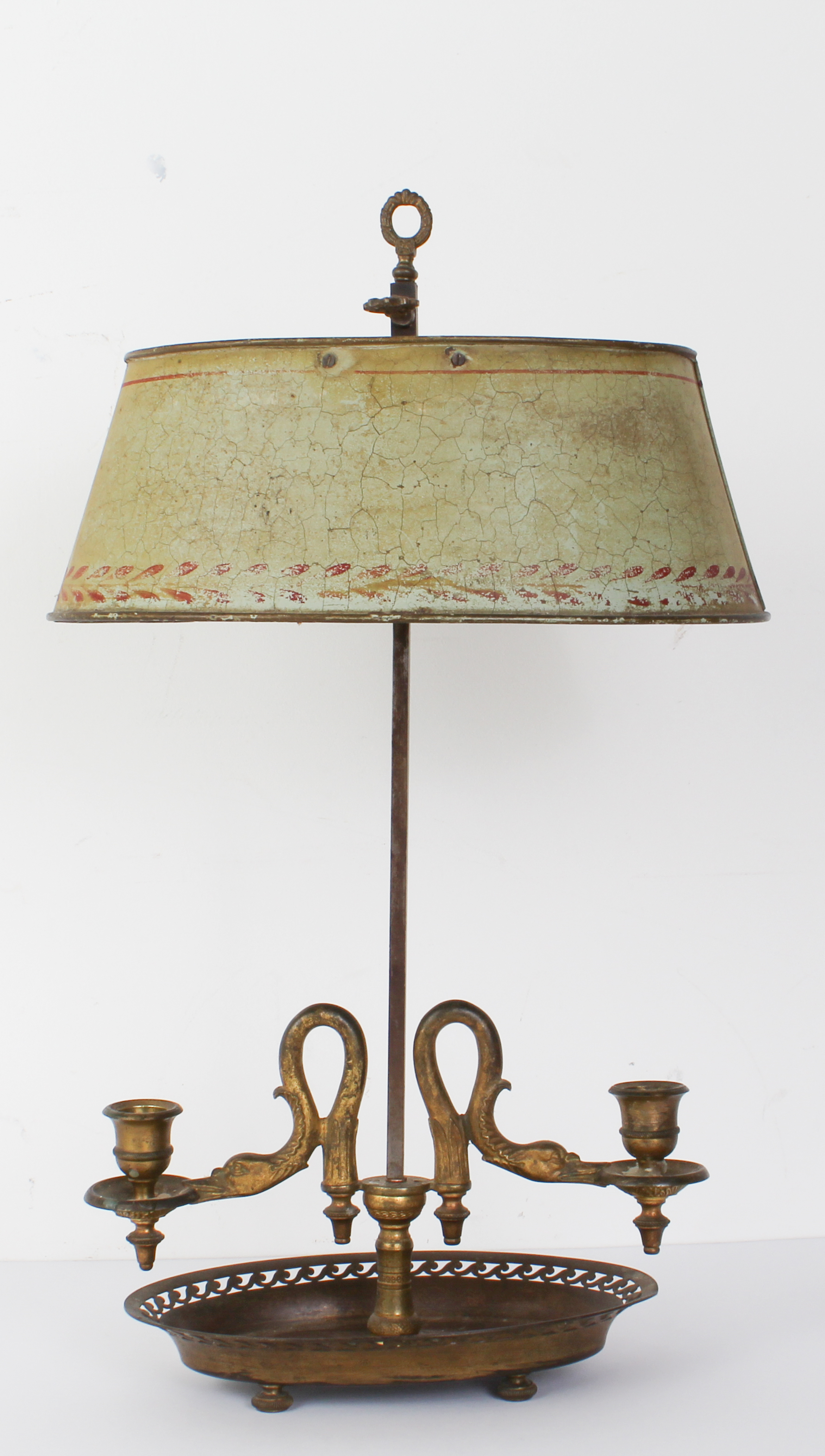 A late 19th century brass bouillotte table-lamp with adjustable toleware shade, twin sconces and