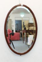 A modern oval mirror with marquetry frame and bevelled plate (89 x 58.5 cm)