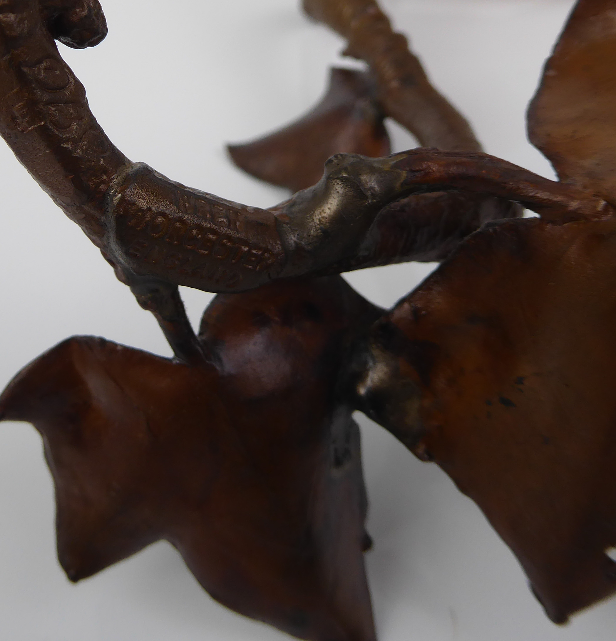 A 20th century cold painted bronze model of a wren setting upon a branch. - Image 4 of 4
