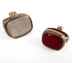 Two 19th century rolled gold fob seals - one larger, in yellow rolled gold, the white agate seal