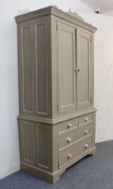 A 19th century style grey painted pine linen press: the shaped cresting over a flared, moulded