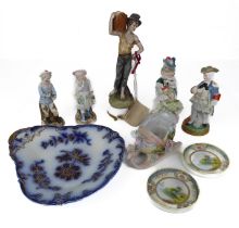 A small group of Continental porcelain figures - including a French figure of a dandy gent with a