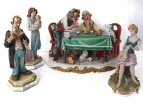 Four Capodimonte porcelain figures - comprising a figural group of a hunter and waiter seated