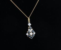 An 18ct yellow gold, sapphire and diamond cluster pendant - stamped '750', with a cluster of six