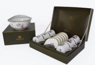 A boxed set of six Royal Worcester bone china coffee cans and saucers, together with a boxed Royal