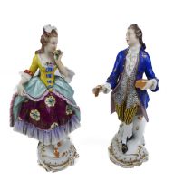 A pair of decorative continental porcelain figurines.
