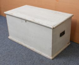 A late 19th century painted pine trunk: the hinged lid on strap hinges, with iron side-handles, on a