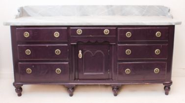 A 19th century painted pine dresser base: the top with raised gallery back, painted in trompe l'oeil