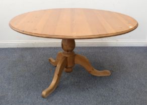 A 19th century style pine circular topped breakfast table with substantial baluster column leading