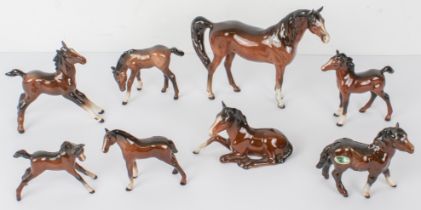Eight Beswick bay horse figures (the tallest 16.5 cm) (Chip noted to the tip of one foal's ear)