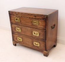 A small brass-bound campaign-style mahogany chest of drawers - late 20th century, with a brushing