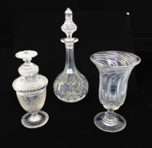 A 19th century cut glass covered goblet - the goblet shaped jar with diamond and blaze cutting and