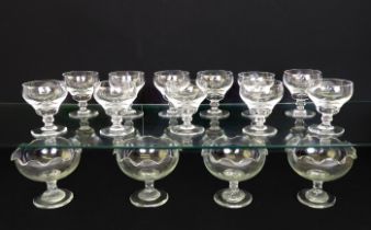 A set of eleven crystal champagne saucers; together with a set of four glass sweetmeat dishes with