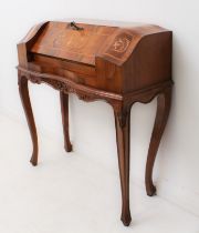 A French walnut and marquetry secretaire, 20th century: in the Louis XVI style, the bombe top with