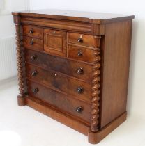 A Victorian mahogany Scottish-style chest of drawers: the full-width ogee top drawer over two