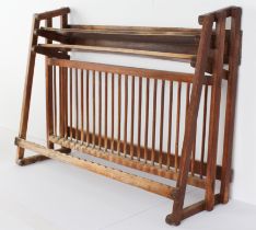 A vintage wall-hanging 24-plate plate rack (LWH 68.5 x 22.5 x 50.5 cm)
