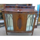 MAHOGANY BOW FRONT CABINET WITH CENTRAL PANEL DOOR FLANKED BY 2 ASTRAGAL GLASS PANEL DOORS ON