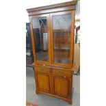 MAHOGANY CABINET WITH 2 GLAZED PANEL DOORS OVER BASE OF 2 DRAWERS OVER 2 PANEL DOORS,