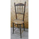 19TH CENTURY CHILD'S CORRECTION CHAIR WITH BERGERE SEAT AND TURNED SUPPORTS