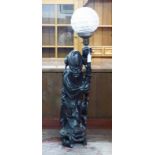 ORIENTAL CARVED HARDWOOD FIGURE OF A PRIEST WITH CUT GLASS GLOBE,