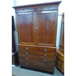 19TH CENTURY MAHOGANY LINEN PRESS WITH 2 PANEL DOORS OVER 2 SHORT AND 3 LONG DRAWERS ON TURNED