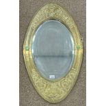 EARLY 20TH CENTURY ARTS AND CRAFTS OVAL BRASS FRAMED MIRROR WITH CELTIC DECORATION AND 2 GLAZED