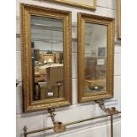 PAIR GILT FRAMED MIRRORS WITH MOUNTED BRASS CANDLESTICKS 78 CM TALL