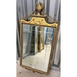 GILT FRAMED BEVELLED EDGE MIRROR WITH CLASSICAL SCENE DECORATION.