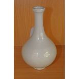 CHINESE WHITE POTTERY VASE DECORATED WITH A DRAGON, WITH 6 CHARACTER MARK TO BASE, 21CM TALL.