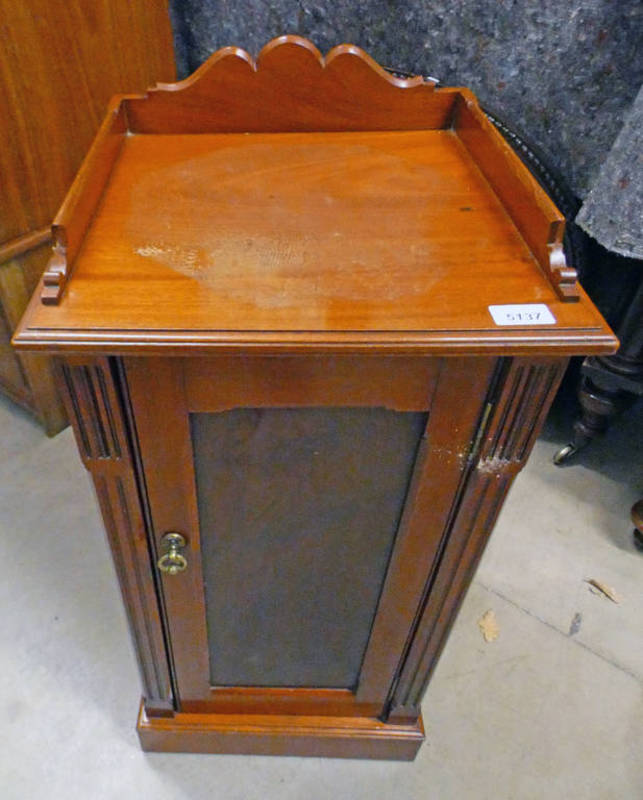 LATE 19TH CENTURY MAHOGANY SINGLE DOOR BEDSIDE CABINET WITH 3/4 GALLERY TOP ON PLINTH BASE.