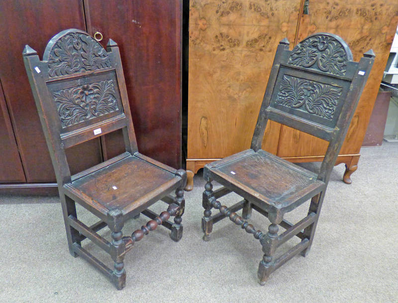PAIR OF EARLY 19TH CENTURY OAK HALL CHAIRS WITH DECORATIVE CARVED BACKS