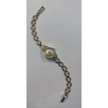 9CT GOLD OMEGA LADIES WRISTWATCH ON A 9CT GOLD BRACELET - 17CM LONG, 16.