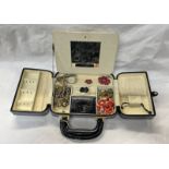 BLACK LEATHER HANDBAG STYLE JEWELLERY BOX AND CONTENTS OF DECORATIVE JEWELLERY INCLUDING ENAMEL