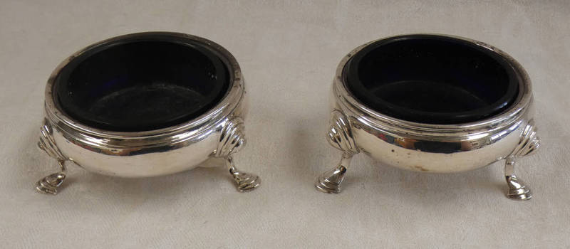 PAIR OF GEORGE II SILVER CIRCULAR SALTS ON HOOF FEET BY BENJAMIN CARTWRIGHT,