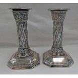 PAIR OF VICTORIAN SILVER OCTAGONAL CANDLESTICKS ON TWISTED COLUMNS WITH EMBOSSED DECORATION,