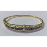 14K GOLD SAPPHIRE & DIAMOND HINGED BANGLE SET WITH CALIBRE CUT SAPPHIRES & BRILLIANT CUT DIAMONDS -