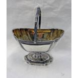 GEORGE III SILVER SWING HANDLED PEDESTAL BASKET WITH GILDED INTERIOR BY JOHN EDWARDS,