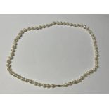 FRESHWATER PEARL NECKLACE ON A 9CT GOLD CLASP - 73CM LONG, 8.