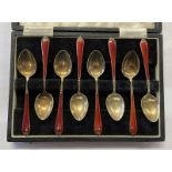 CASED SET OF 8 SILVER GILT & RED ENAMEL COFFEE SPOONS BY ADIE BROS,