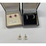 PAIR 9CT GOLD GARNET SET EARSTUDS,