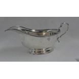 SILVER SAUCE BOAT ON CIRCULAR BASE,