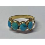 19TH CENTURY TURQUOISE 4-STONE SET RING IN DECORATIVE SETTING Condition Report: Ring