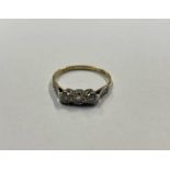 18CT GOLD & PLATINUM 3 - STONE DIAMOND SET RING - 2.