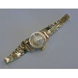 18CT GOLD LADIES OMEGA WRISTWATCH ON A 9CT GOLD WRISTWATCH, MOVEMENT NO. 20757957, CASE NO.