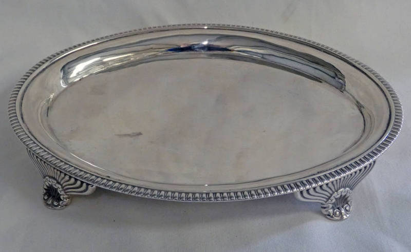 GEORGE III SILVER OVAL TEAPOT STAND WITH 4 SCROLL SUPPORTS, LONDON 1809 - 21.