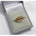 18CT GOLD 5-STONE DIAMOND SET RING IN SCROLL MOUNT - 1 STONE MISSING