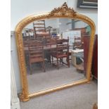 LARGE GILT FRAMED OVERMANTLE MIRROR SURMOUNTED BY FLORAL WREATH,