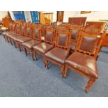 SET OF 18 OAK DINING CHAIRS WITH LEATHER PADDED BACKS AND SEATS WITH CARVED CREST AND 1890 TO